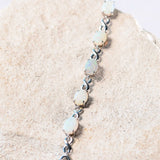 white opal silver bracelet with an eternity design