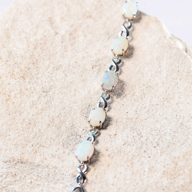 white opal silver bracelet with an eternity design