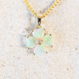 green crystal opal gold pendant in a flower design