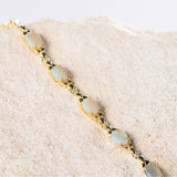 white opal bracelet featuring five green coloured white opals