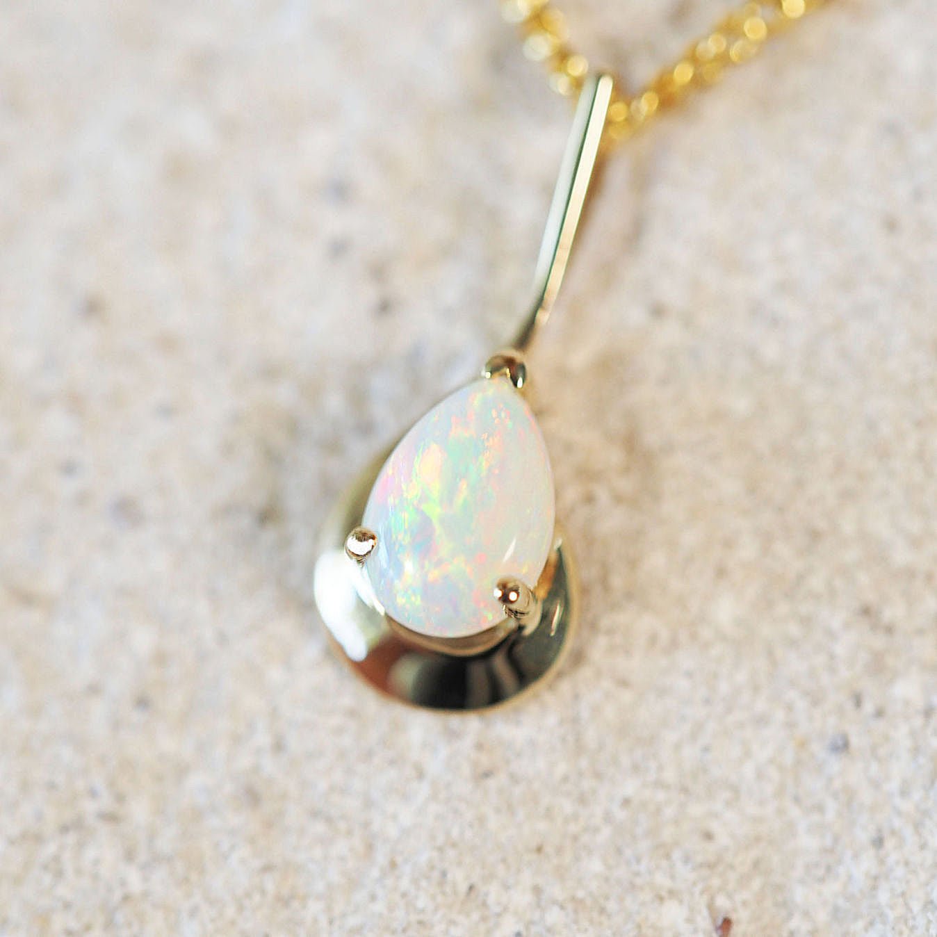 colourful white opal pendant set in gold