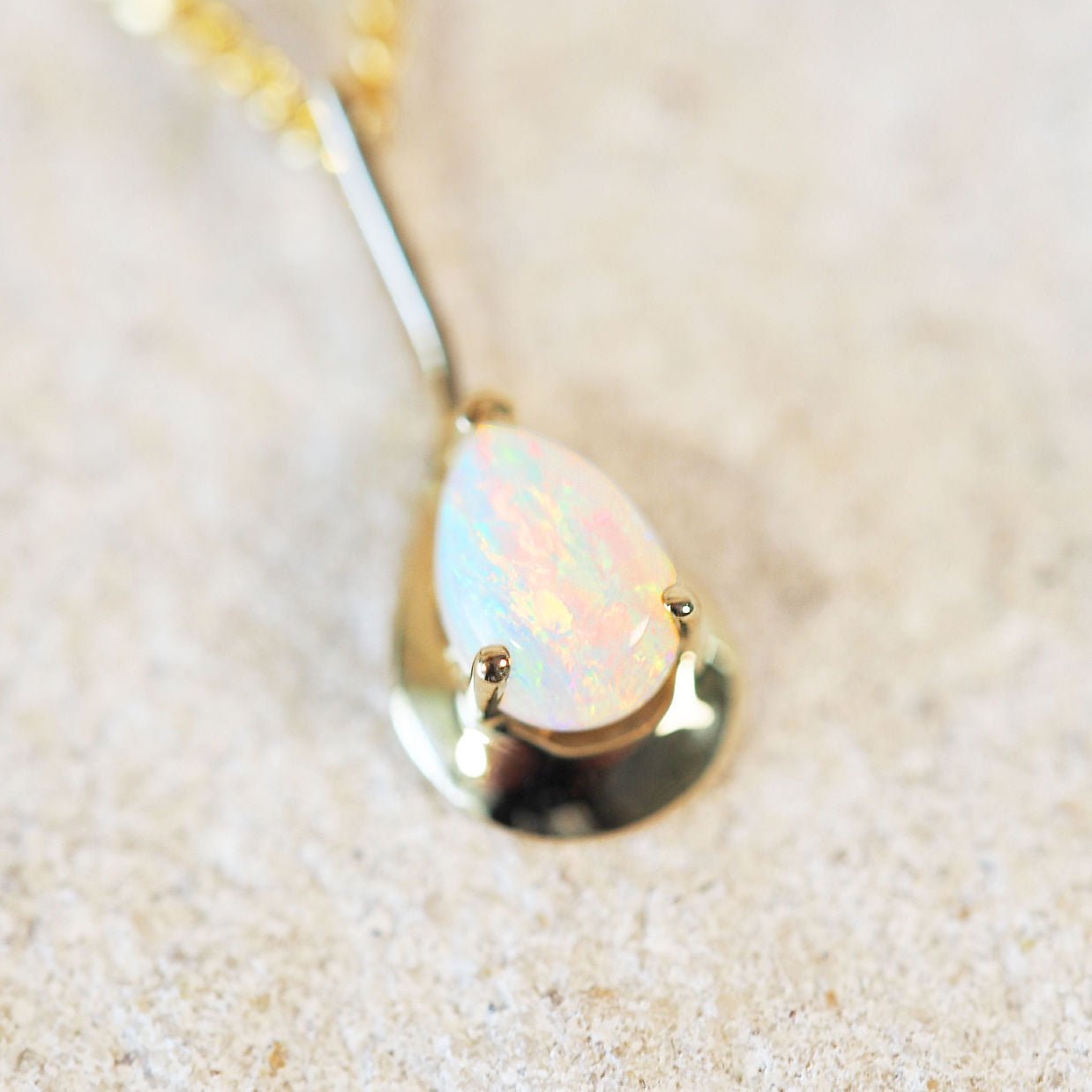 colourful white opal gold pendant 