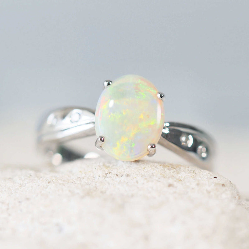 crystal opal white gold ring with four diamonds