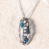 silver doublet opal pendant in a unique cage dedign