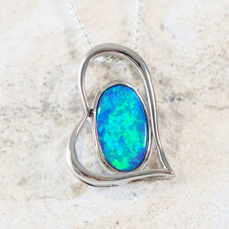 green and blue oval shaped silver doublet opal pendant