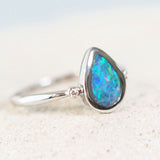 greed and blue black opal ring set in white gold