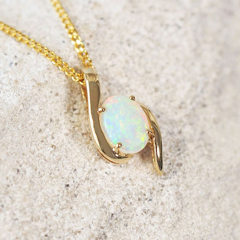 white opal gold pendant featuring green colour