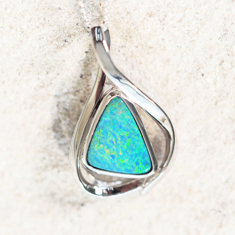 green and blue australian opal with orange flashes set into a silver opal pendant
