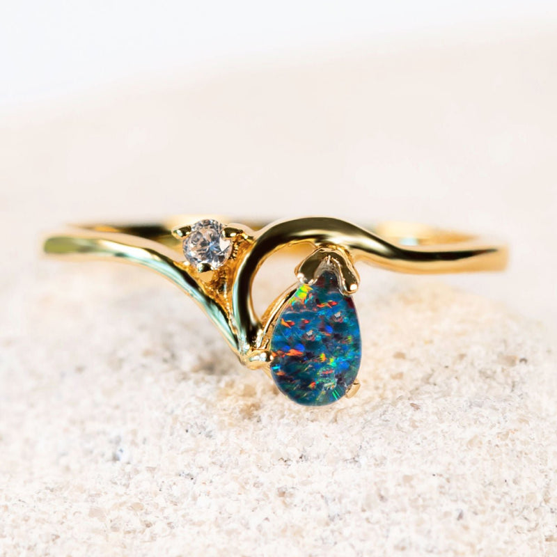 colourful australian opal ring set with a tear-drop shaped triplet opal set into gold plated silver and one cubic zirconia