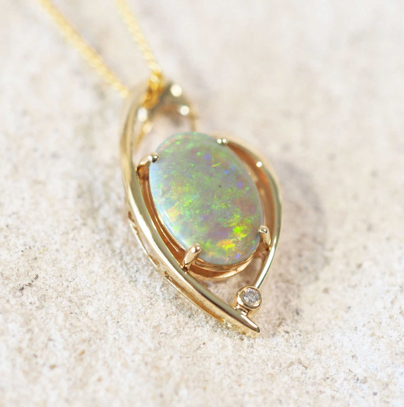 dark crystal opal gold pendant