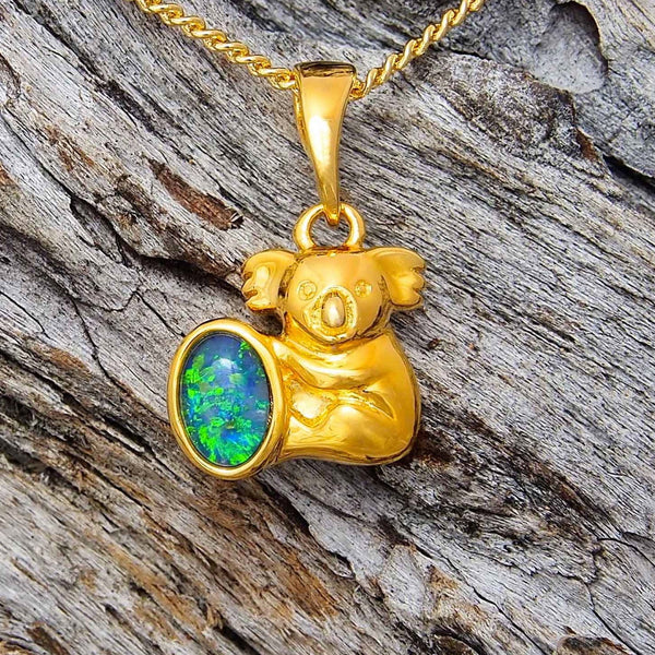 Gold plated sterling silver koala design necklace pendant bezel set with a green and blue oval triplet opal