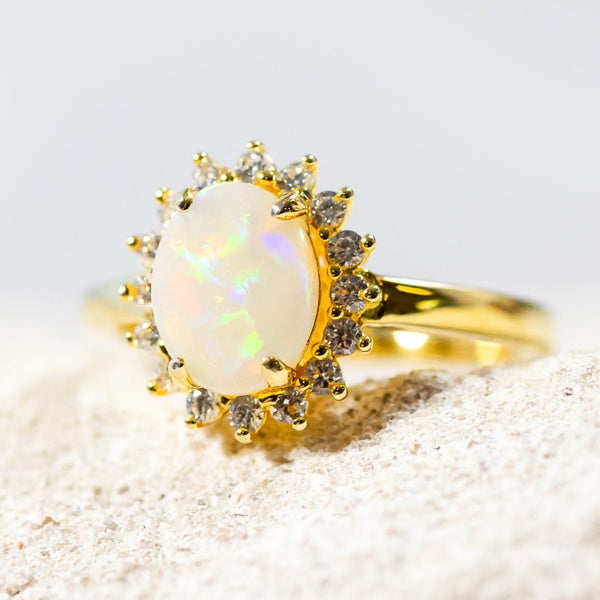 colourful oval australian sold white opal set in a gold plated silver princess style ring
