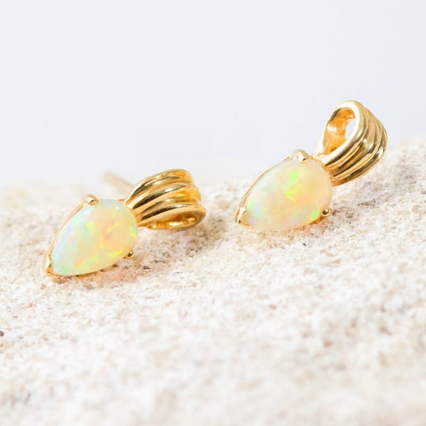 colourful pear shaped crystal opal gold earrings featuring a scroll design