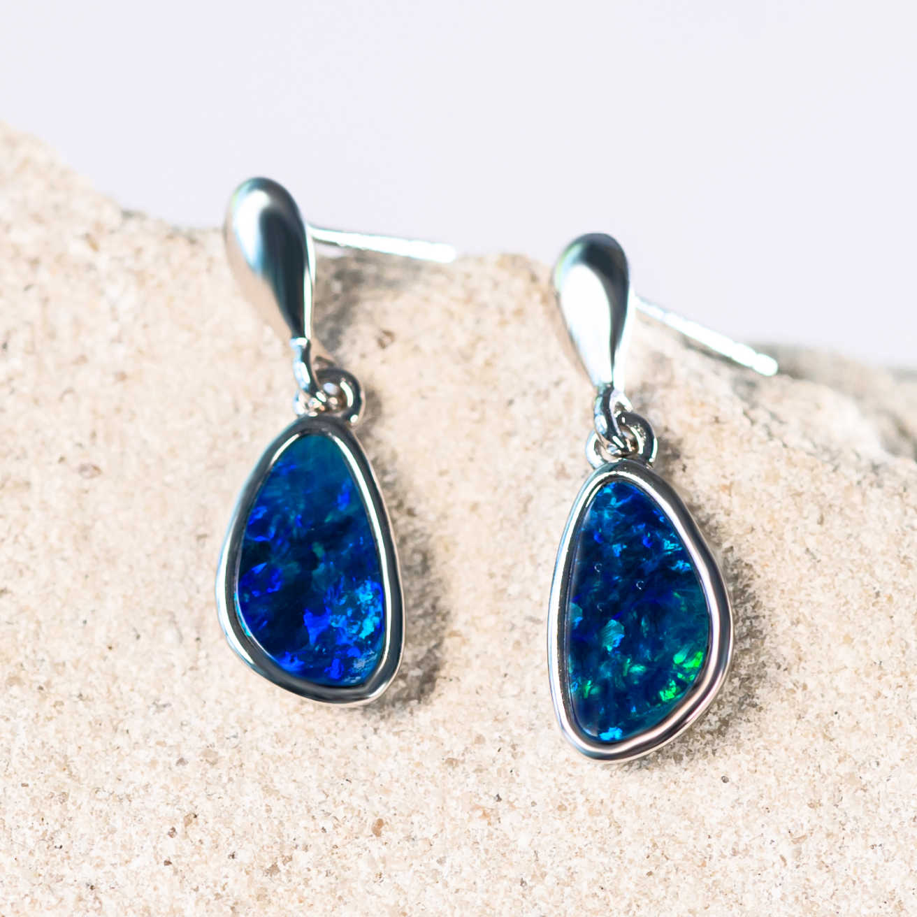 blue and green doublet opals in silver earrings