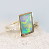 colourful black Lightning Ridge opal gold ring with diamonds