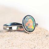white gold opal ring with a crystal opal