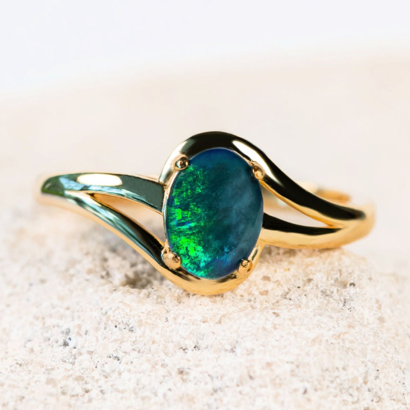 australian opal ring featuring a blue and green triplet opal set in gold plated silver