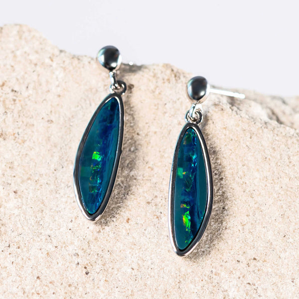 green and blue long freeform shaped doublet opals set in silver earrings