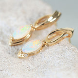 elegant gold earrings set with crystal opals and diamonds