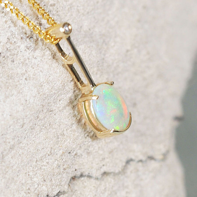 green and blue south australian crystal opal gold pendant with a diamond
