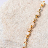 white opal bracelet set in a passion design gold plated silver setting