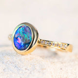 blue opal engagement ring set in gold with diamonds