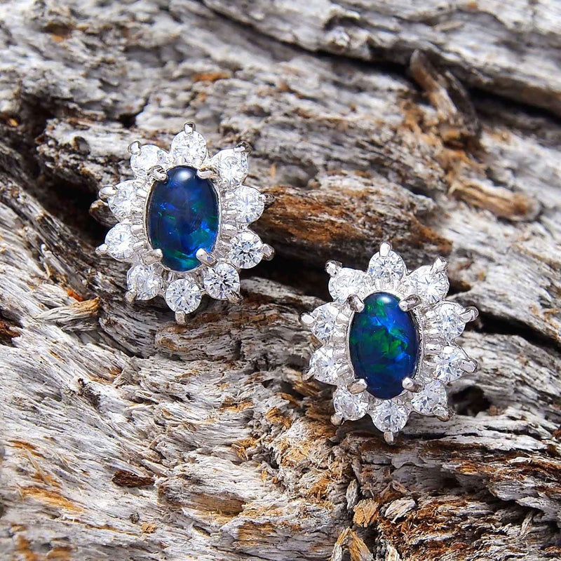 Dazzling princess design sterling silver oval stud earrings each claw set with green and blue triplet opals surrounded by 10 diamantes
