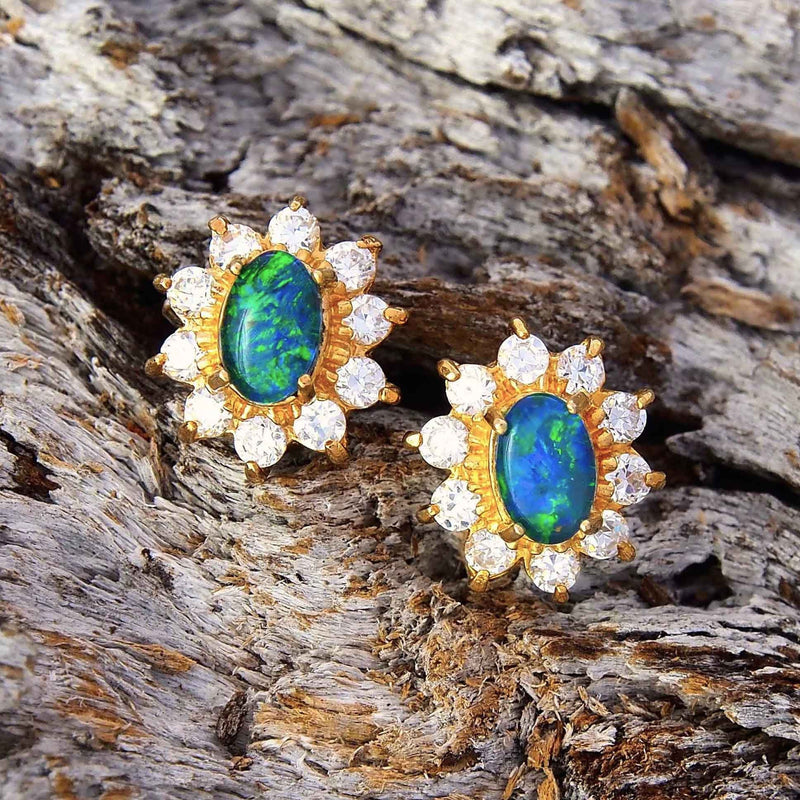 Dazzling princess design gold plated sterling silver stud earrings each claw set with green and blue oval triplet opals surrounded by 10 diamantes