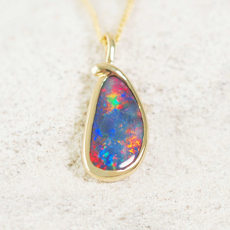 colourful black opal pendant set in 18ct gold