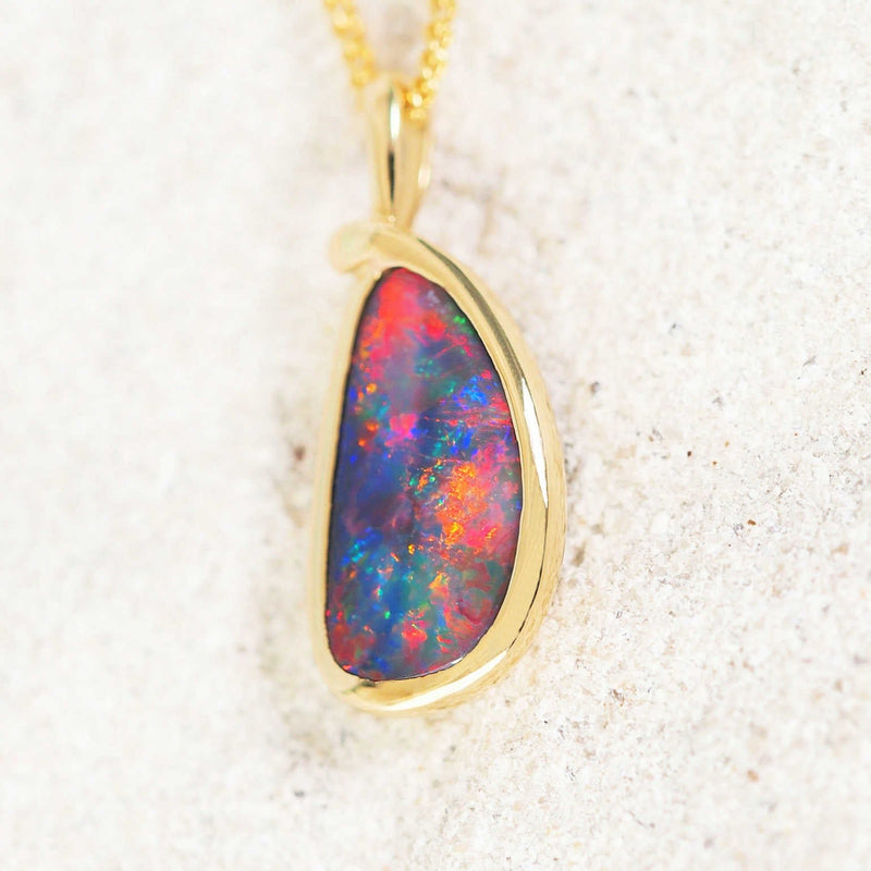 colourful black opal pendant set in 18ct yellow gold
