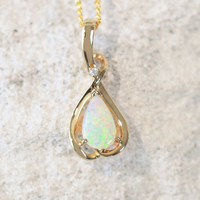 multi-colour 14ct yellow gold opal pendant with one diamond