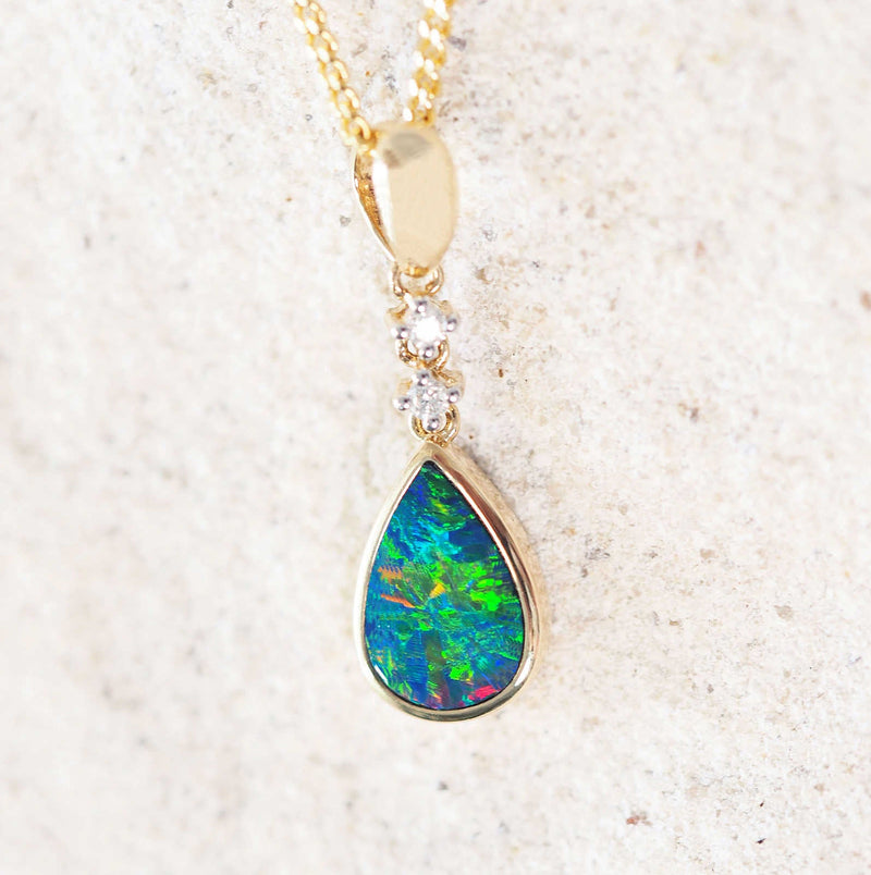 multi-colour doublet opal pendant set in 14ct yellow gold with two diamonds