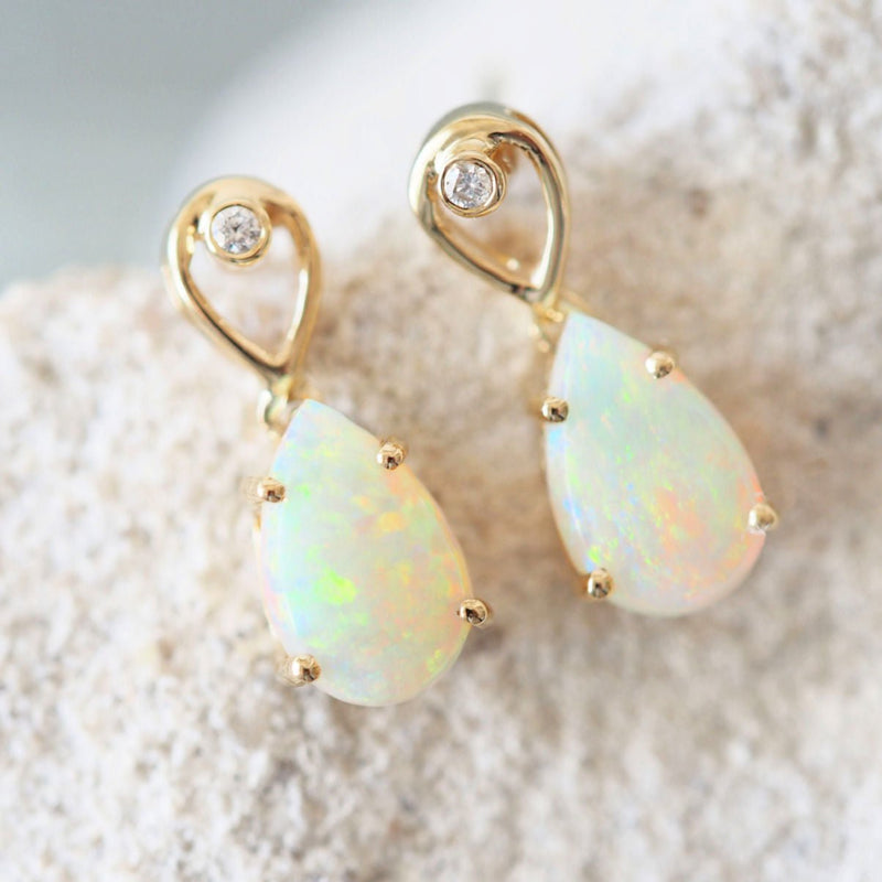 crystal opal earrings set with gold and diamonds