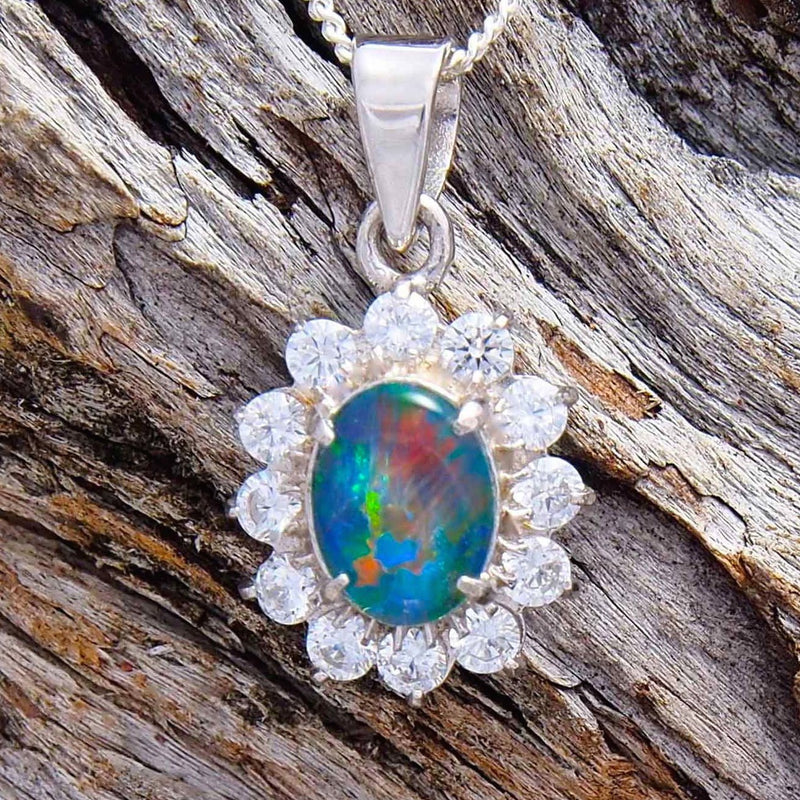 Beautiful sterling silver princess design opal necklace pendant claw set with a colourful oval Australian triplet opal and twelve cubic zirconias.