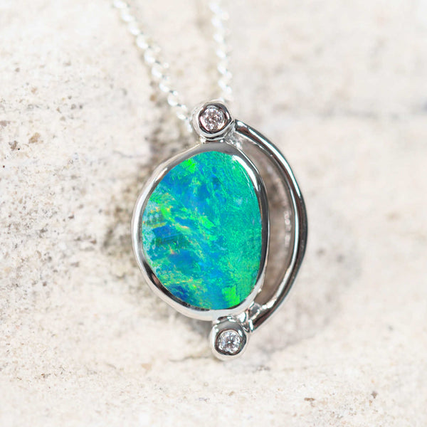 green and blue doublet opal set in silver with two sparkling cubic zirconias pendant