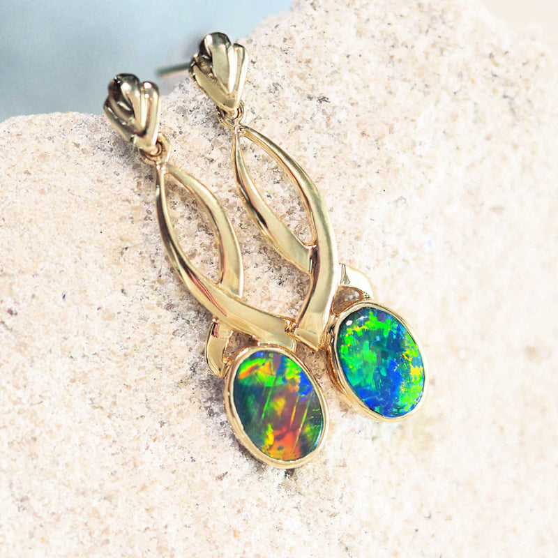 colourful oval australian opal earrings set in 14ct yellow gold